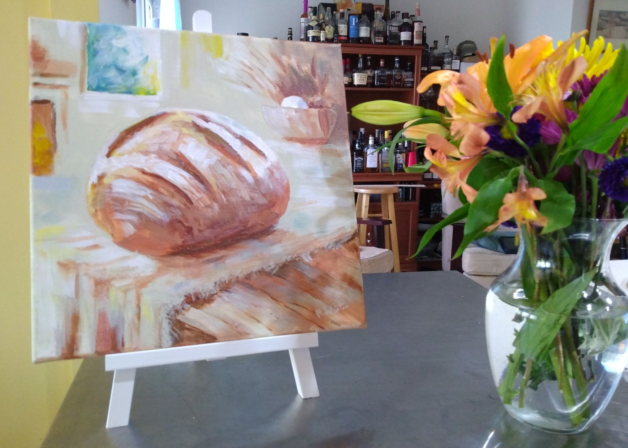 impressionistic painting of baked bread sitting on table in morning sunlight
