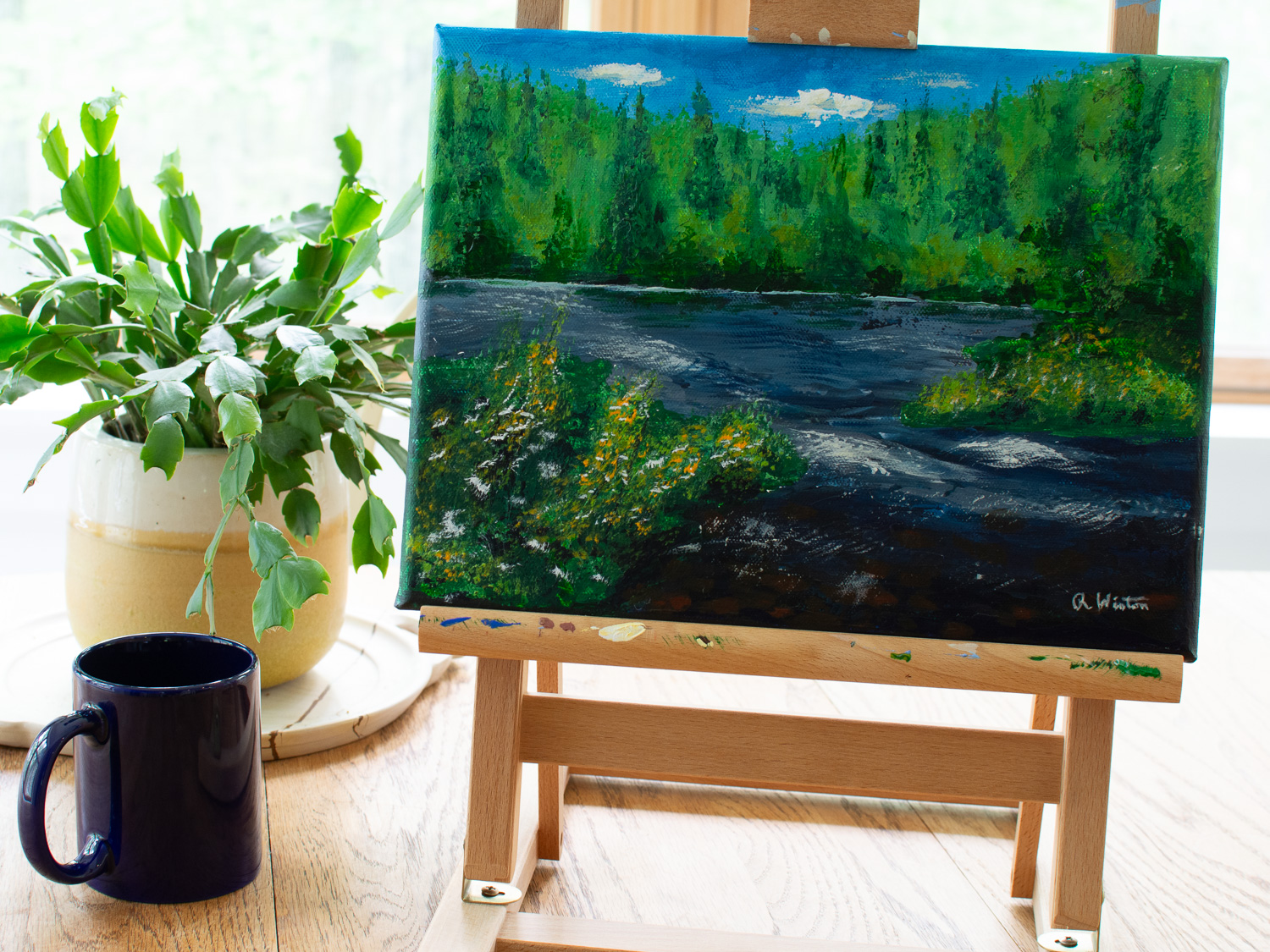 original painting of Tobyhanna Falls in the Poconos sitting on a table